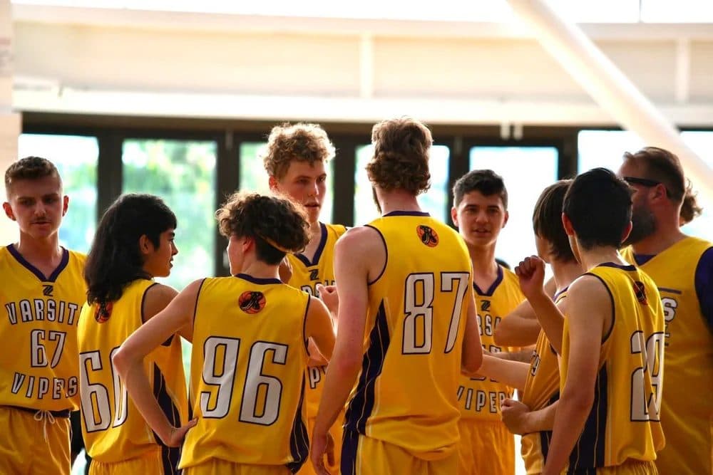 Varsity Vipers players in a game-day huddle